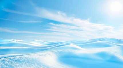A beautiful background of blue sky and white snow, with undulating hills covered in soft ripples