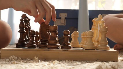 Experience children mastering chess. Witness strategic brilliance as they delve into tchess game...