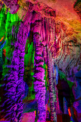 The beautifully illuminated Silver Caves displaying stalactite formations.
