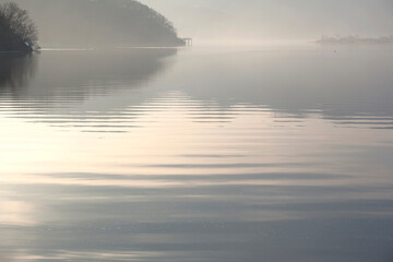 View of the foggy lake in the morning