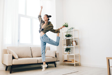 Playful Woman Jumping for Joy in her Relaxation Room with Music and Dancing, Happy and Carefree.
