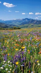 A panoramic view of a vast meadow carpeted in vibrant wildflowers, stretching towards a distant mountain