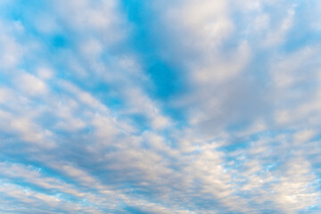 Naklejka na ściany i meble Sky with clouds. Cloudy skyscape background. Cloudscape sky background. Cloud in the sky. Background with cloud. Bright sky with overcast clouds. Skyscape and cloudscape