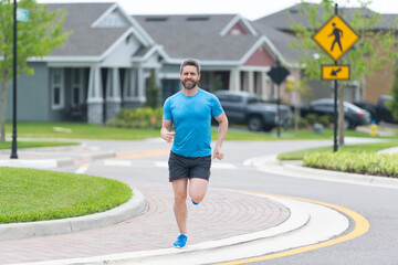 Man sportsman running for exercise outdoor. In a morning sport workout jogger run. Hispanic...