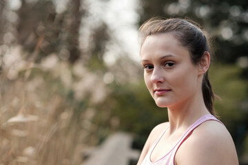 Relaxed sport caucasian woman looking at camera.