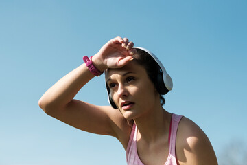 Portrait of authentic fitness woman looking confident and strong after exercise.