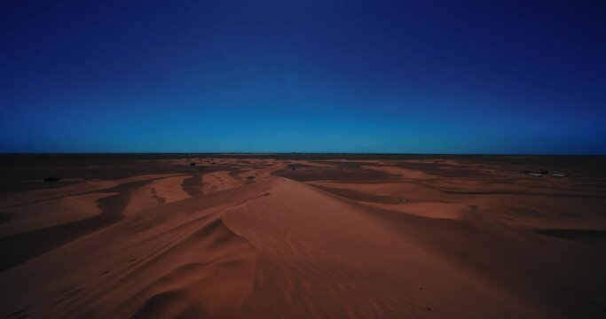 A panoramic sand dune of sahara desert at Mhamid el Ghizlane in Morocco wide shot