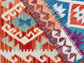 Close up photo of colorful Afghan Handwoven Wool Kilim rugs with abrash effect, showing various tribal motifs represents tribal belief. 