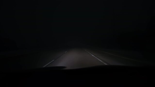 POV Point of view, car driving on way on extremely foggy environment. Wide shot