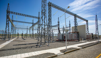 a large electrical substation with a lot of wires going through it