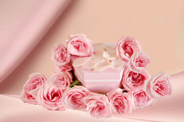 Pink product podium placement with roses flowers  on fabric background, Empty podium with rose and petals for display gifts, products or cosmetics
