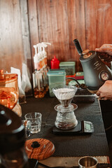 Person Pouring a Cup of Coffee From a Coffee Maker