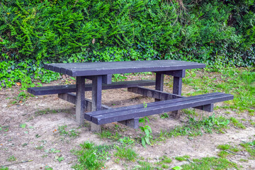 Table outside, black with benches