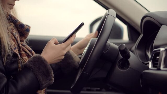 Driver texting while driving . Road safety rules
