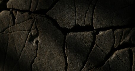 Cracked Stone Surface in mystical lighting. Close-up, shallow dof.