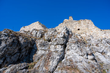 The historic stone walls of Devín Castle on a rocky cliff.