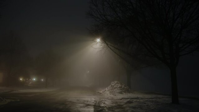 Dark street whit street light at night with heavy fog. Wide shot