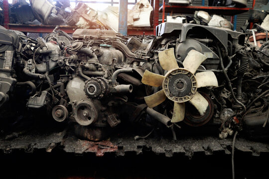 Auto parts and secondhand engine components in auto spare parts store. Spare parts of vehicle in warehouse.
