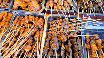 Various types of food and satay menus sold at Angkringan or street food carts in Yogyakarta,...