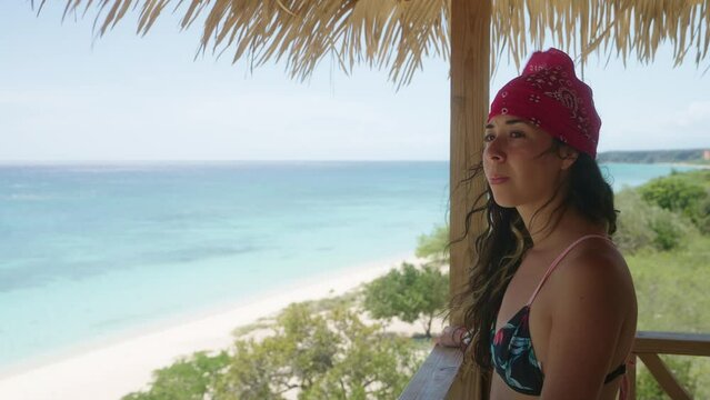 Hispanic woman in bikini on a tropical island travel destination