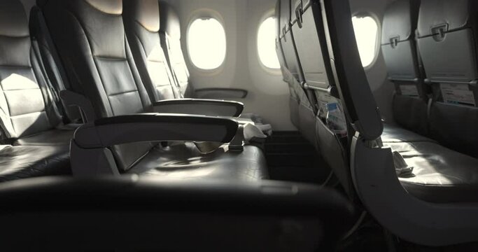 Empty Airplane seats on bright day tilt up to reveal