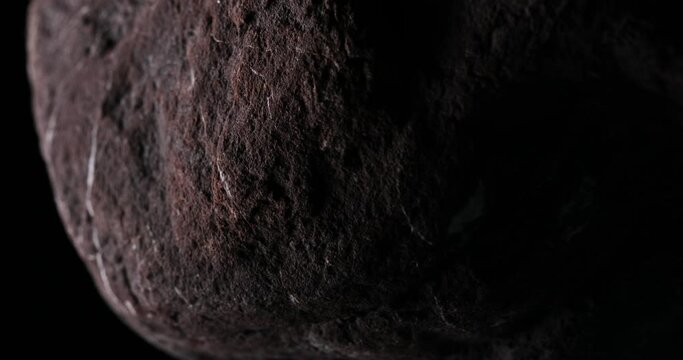 Darkened Stony Sphere. Close-up, shallow dof.