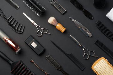 Fototapeta premium Variety of Hair Styling Tools and Accessories Displayed on a Dark Background