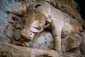 Fototapeta na wymiar Many buddhist carving at landscape of Dazu rock carving