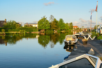 Naklejka premium Landscape of Canal Cruise in Amsterdam with perfect reflection