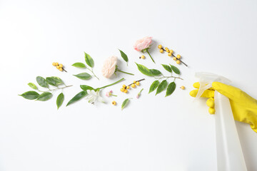 Detergents with fresh flowers on a white background - obrazy, fototapety, plakaty