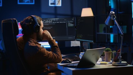 Frenzied programmer suffering from adhd illness, impatiently taping desk with fingers while writing...