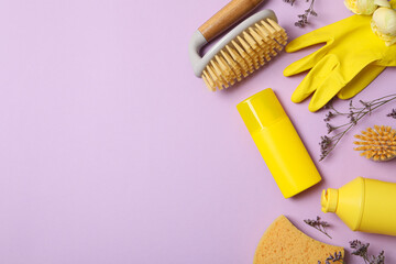 Yellow rubber gloves with flowers and brushes