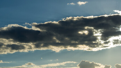 Dark cloud against the blue evening sky. - 780331318