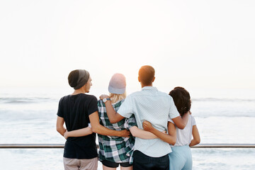 Sunshine, hug and back of friends by ocean for holiday, summer vacation and relax outdoors....