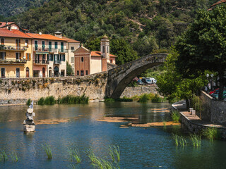 Fototapeta na wymiar Old bridge over the river in Dolceacqua, Italy.