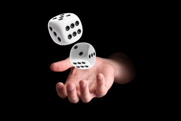 Man throwing white dice on black background, closeup