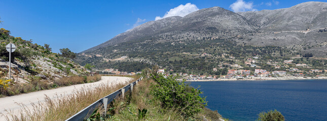 View of the sea, mountains and road (Kefalonia Island, Greece) from a height