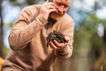 Compost pile, organic thermophilic compost turning in Tasmania Australia, holding soil.