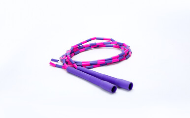 purple and pink skipping rope isolated on white background