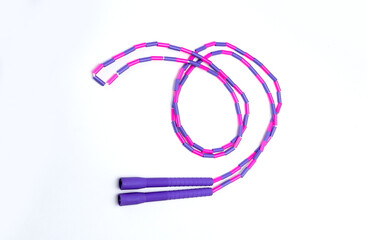 purple and pink skipping rope isolated on white background