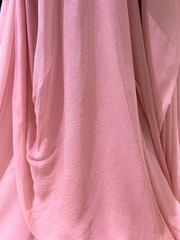 Pink fabric as an abstract background. Textures