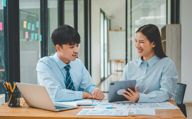 group of business people working and communicating together in the office With the charging of graphs for analysis, conceptual analysis and business planning