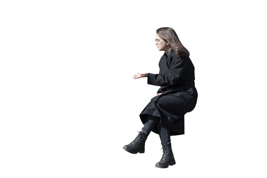 A woman in black coat in sitting pose isolated	