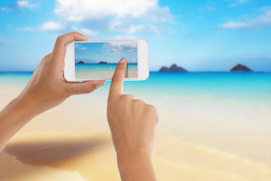 Hands, phone and screen for ocean photo, travel and camera app to capture sea in outdoor nature. Person, closeup and scroll on social media for holiday destination, vacation and beach post for update