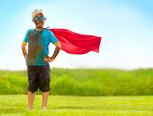 Portrait, confident and superhero kid outdoor with wind on cape, goggles and mockup on blue sky....