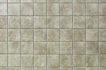 Light brown ceramic tiled floor with stone effect, rustic style. Background and texture.