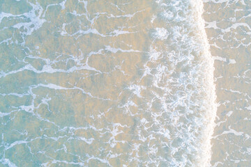 close up view of the sea water reaching the shore of the beach, texture for backgrounds