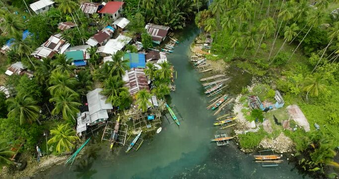 Tradional fishing boats floating over Bogac Cold Spring in Surigao del Sur. Philippines.