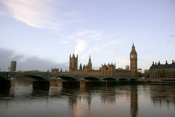 The image captures the iconic view of Westminster Bridge and the Big Ben in London during a stunning sunset