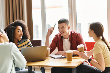 A diverse group of students engaged in animated conversation around a table in an educational...